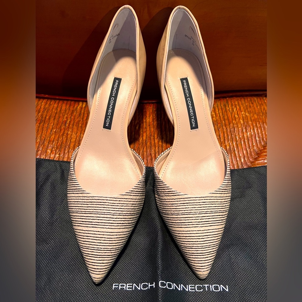 Tan heels with black striped toes.
